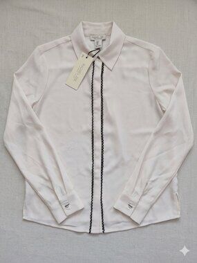 A beautiful and chic blouse from Rachel Zoe. Crafted from 100% polyester